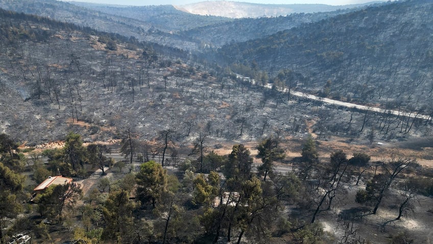 firefighters contain major fire around athens fear extreme heat may cause new fires to erupt