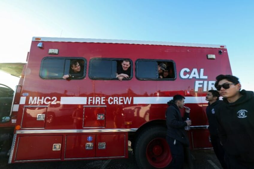 Around 5,000 firefighters have made an impromptu home on Zuma Beach to eat, sleep and reco