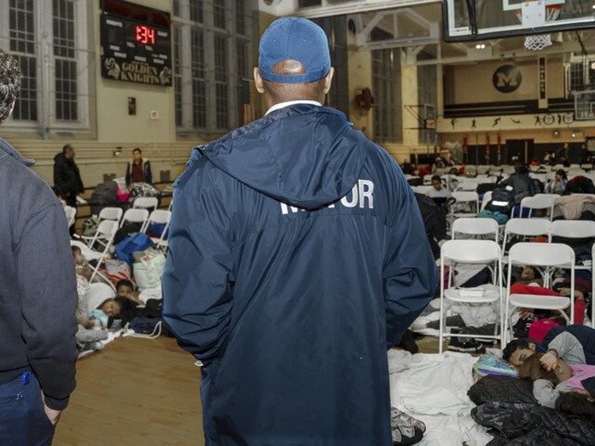 In this photo provided by the Office of the Mayor New York, New York Mayor Eric Adams visits with asylum seekers taking shelter at James Madison High School, in the Brooklyn borough of New York, Tuesday, Jan. 9, 2024. New York City was forced to evacuate migrants from a massive …