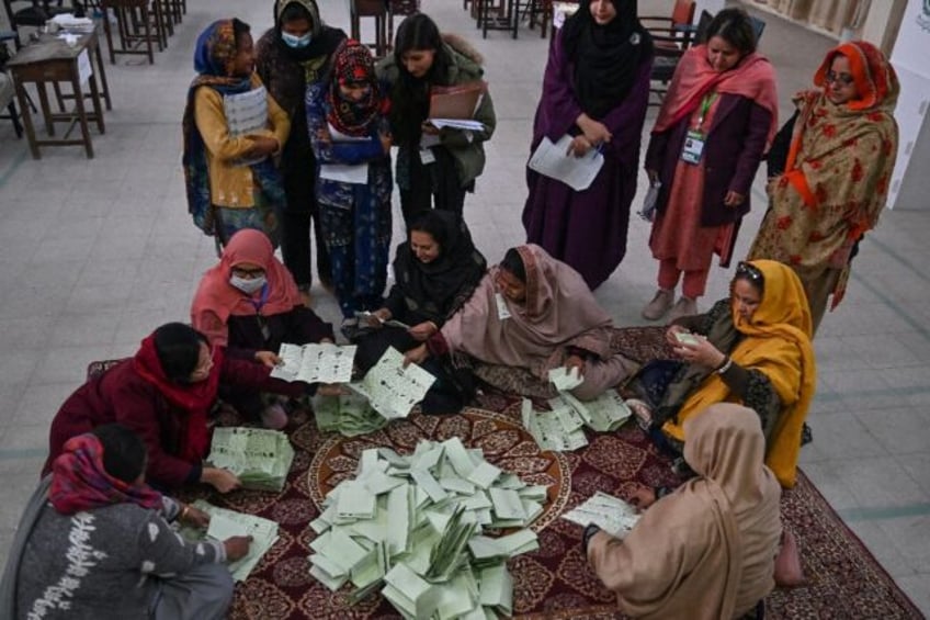 Pakistan election officials count votes after the closing of polls