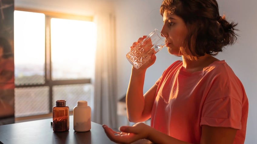 Woman taking supplements