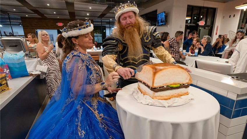 Jamie West and Drew Schmitt cut their slider cake.