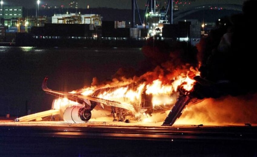 A Japan Airlines plane was in flames on the runway of Tokyo's Haneda Airport on Tuesday after apparently colliding with a coast guard aircraft