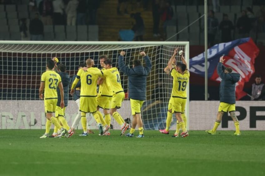 Villarreal's players celebrate their thrilling 5-3 victory over Barcelona in La Liga on Saturday at the Olympic Stadium