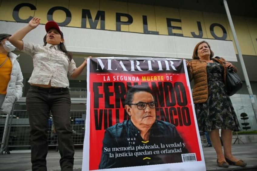 Supporters of Fernando Villavicencio shout slogans as they await sentencing for five suspe