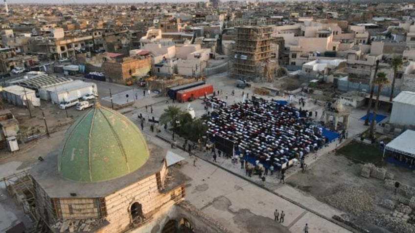 Muslims gathered to pray in the courtyard of the Al-Nuri mosque in Mosul during Eid al-Adh