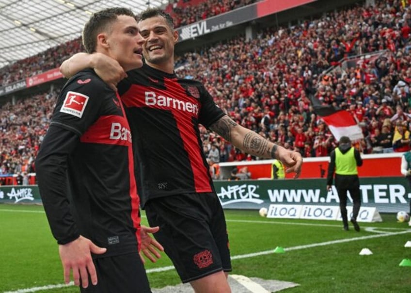 Key men: Florian Wirtz (L) is congratulated after scoring against Werder Bremen by Granit