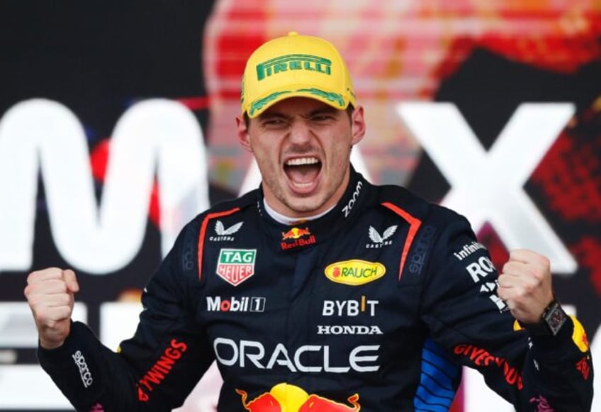 Winning feeling: Max Verstappen celebrates on the podium after victory in Sao Paulo