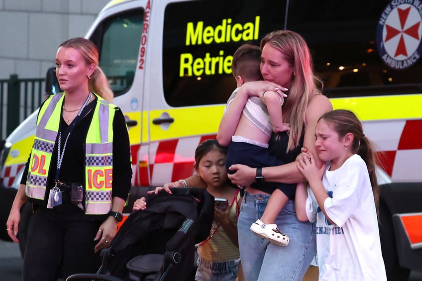 Paramedics are seen with stretchers outside the Westfield Bondi Junction shopping mall after a stabbing incident in Sydney on April 13, 2024. Australian police on April 13 said they had received reports that "multiple people" were stabbed at a busy shopping centre in Sydney. (Photo by David GRAY / AFP) (Photo by DAVID GRAY/AFP via Getty Images)