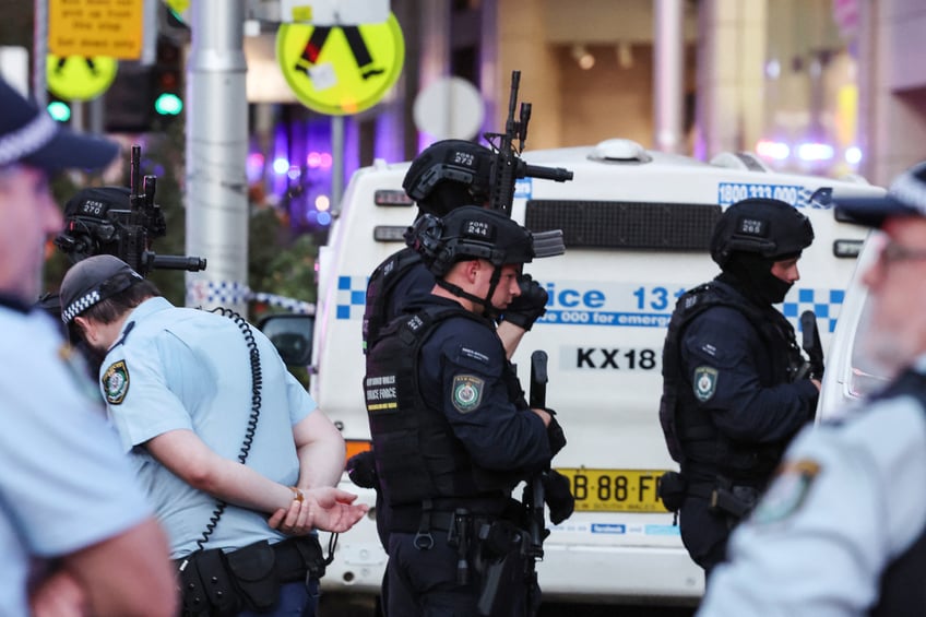 Police enter the Westfield Bondi Junction shopping mall after a stabbing incident in Sydney on April 13, 2024. Australian police on April 13 said they had received reports that "multiple people" were stabbed at a busy shopping centre in Sydney. (Photo by David GRAY / AFP) (Photo by DAVID GRAY/AFP via Getty Images)