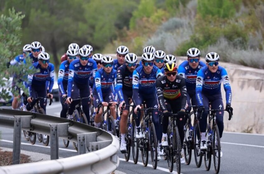 Leader of the pack: Remco Evenepoel (centre) and teammates take part in a training ride in Spain