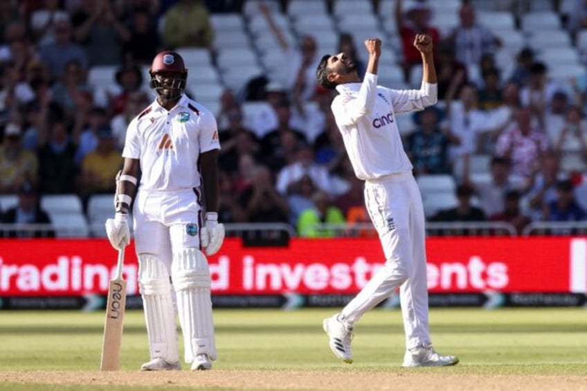 Moment of victory: England's Shoaib Bashir (R) celebrates dismissing West Indies No 11 Sha