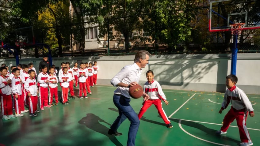 flagrant foul newsom plows through a small child during pickup basketball game in china