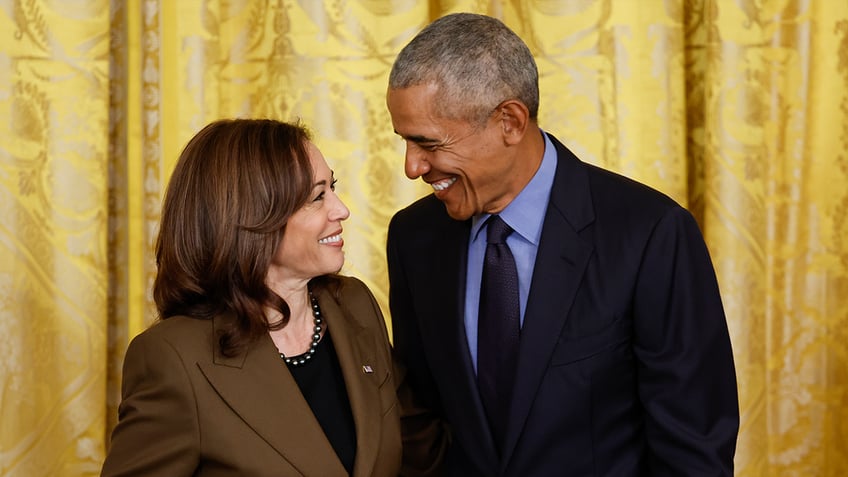 Barack Obama, right, and Kamala Harris at event