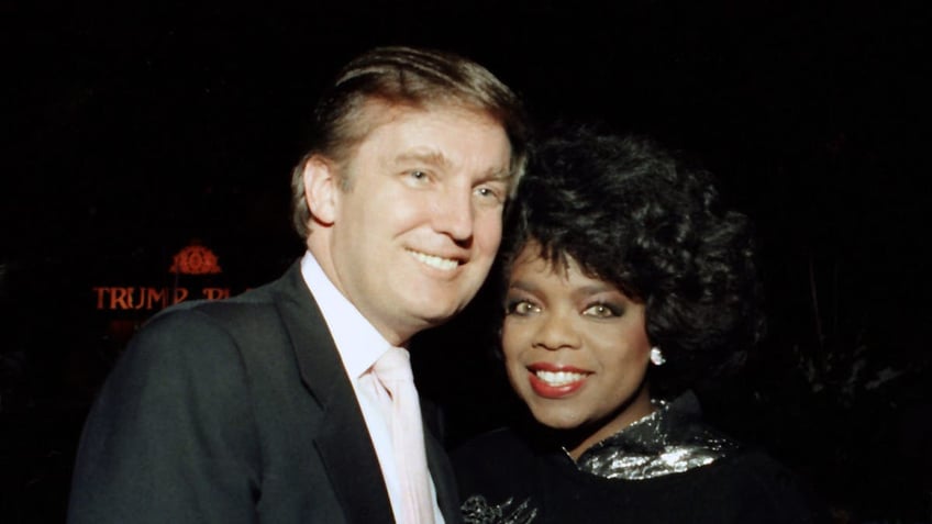 Donald Trump and Oprah Winfrey at Tyson vs Holmes Convention Hall in Atlantic City, New Jersey.