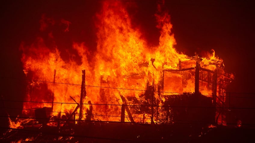 raging fire in California consuming a structure