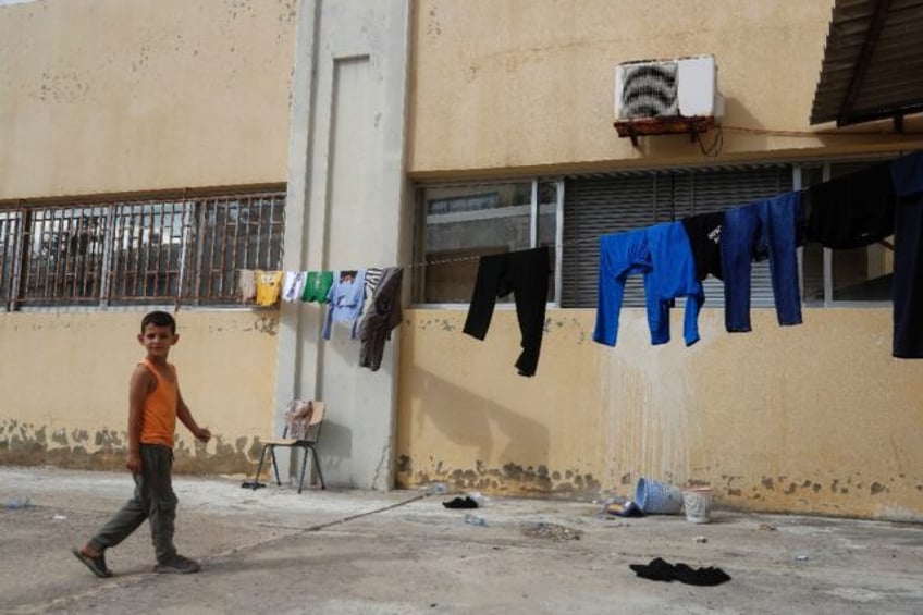 fleeing israel strikes south lebanon families move into schools