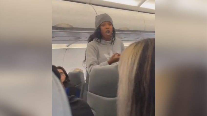 flight descends into chaos when possessed woman begins screaming jumping over seats theres a real devil