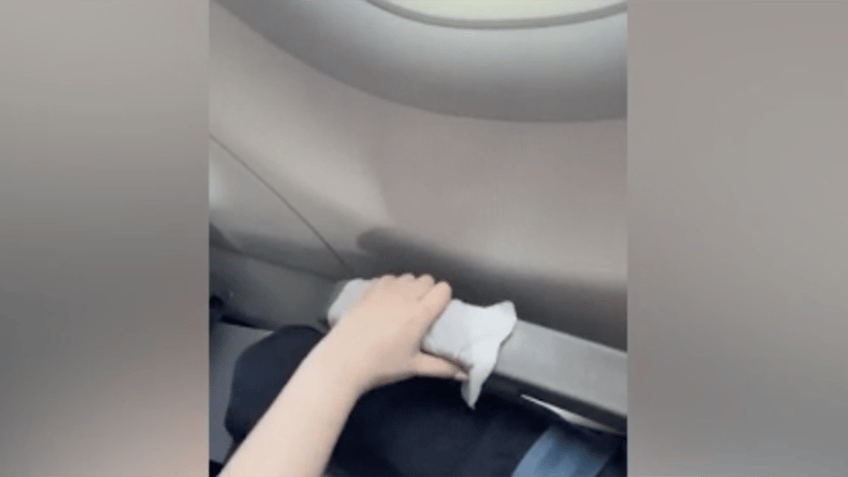 flight passenger feels dizzy after man behind her puts his bare feet up on her armrest see her reaction