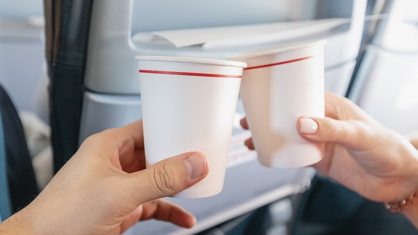 hot cup hack using coffee cups on plane