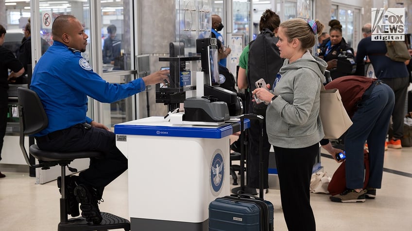 Scenes at the airport as REAL ID requirements go into effect