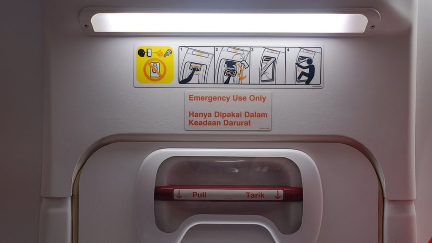 An emergency door in the aircraft cabin