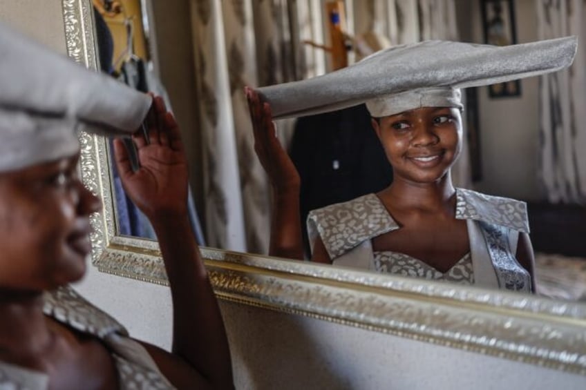 A model poses in a design by McBright Kavari of the traditional dress of Namibia's Herero