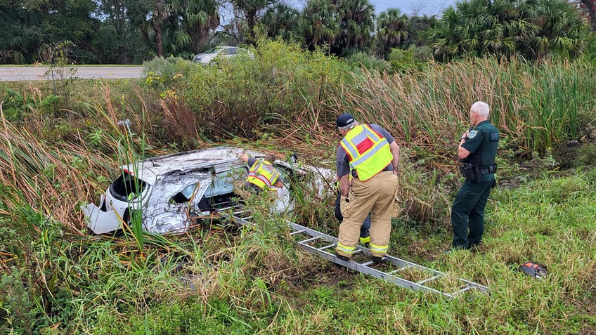 First responders form human chain to recover Christmas gifts.