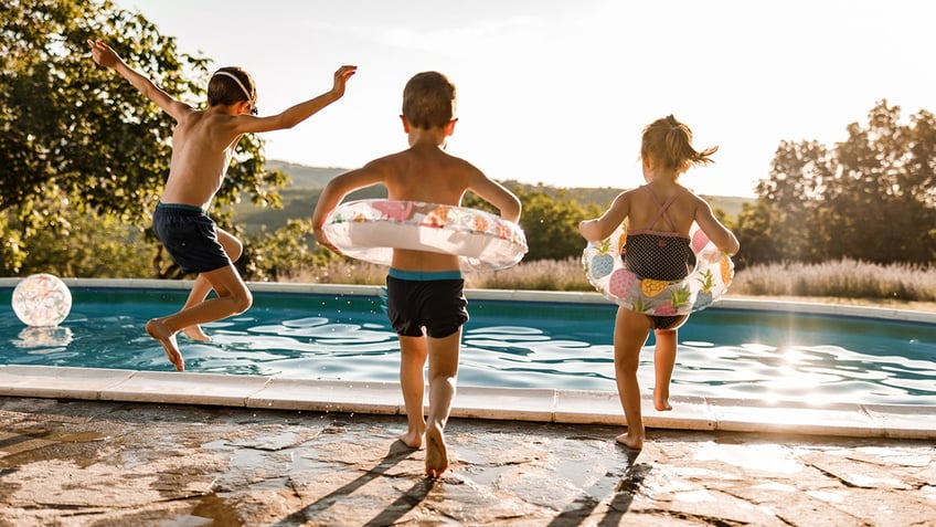 kids jumping in pool