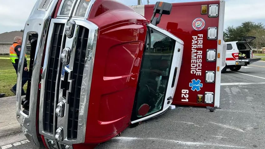 florida fire rescue vehicle gets slammed onto its side in crash with bus truck while responding to call