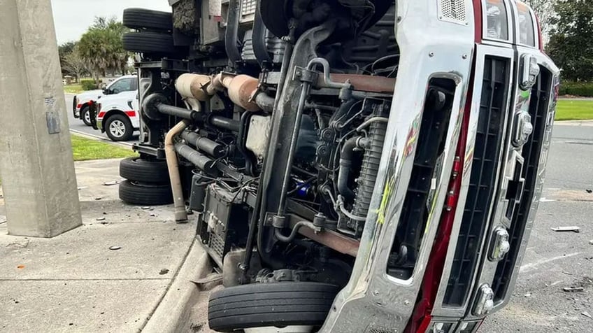 florida fire rescue vehicle gets slammed onto its side in crash with bus truck while responding to call