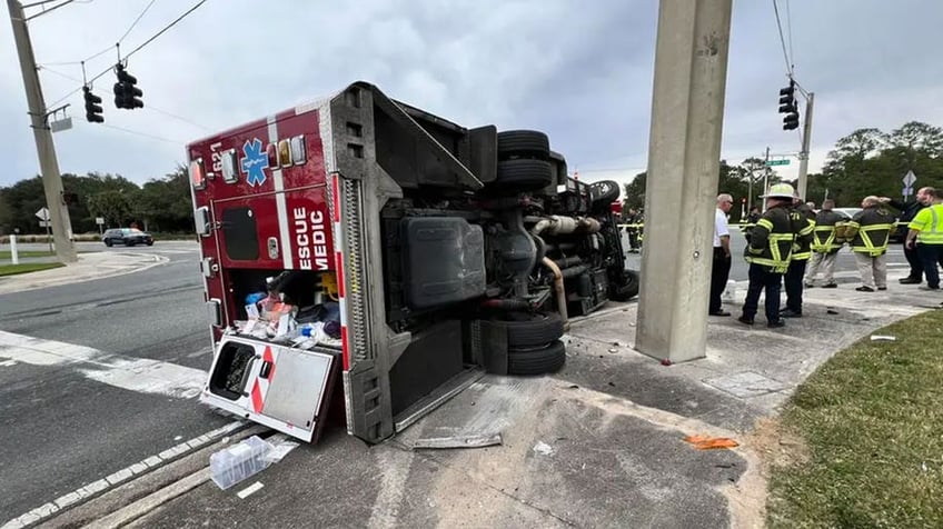 florida fire rescue vehicle gets slammed onto its side in crash with bus truck while responding to call