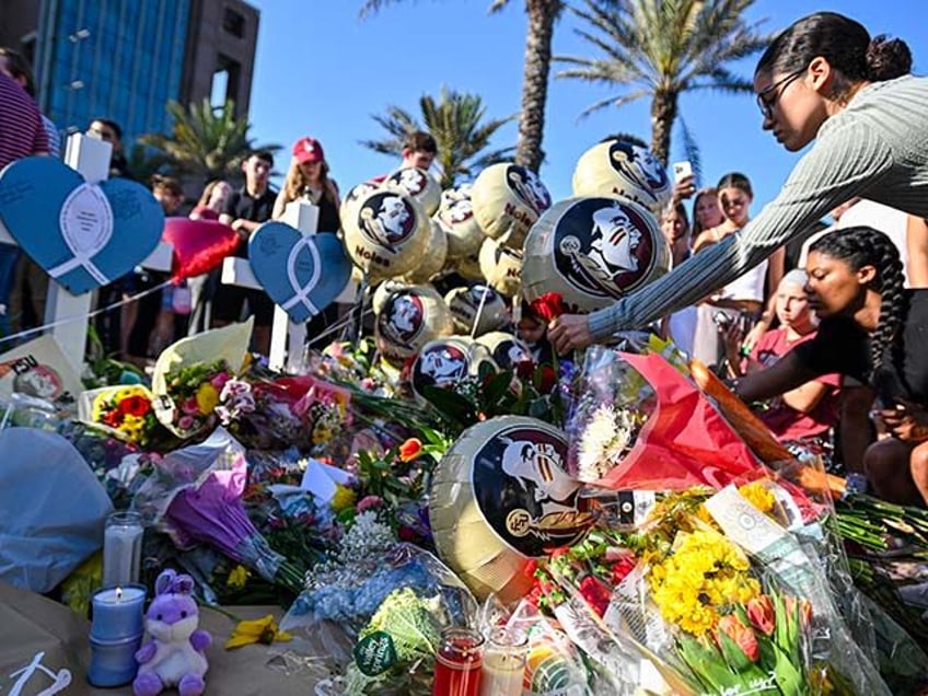 Community members, students, and faculty gathered for a vigil honoring the victims of the