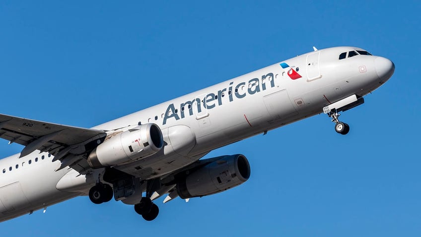 An American Airlines airplane appearing to take off from an airport