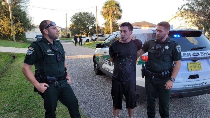 florida mans leap into canal leaves pursuing deputies asking in bodycam video what are you doing