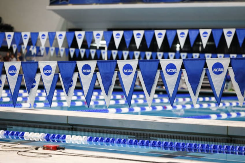 Pennants with the NCAA Logo hang over the pool during the Division I Men's Swimming and Diving Championships at IU Natatorium at IUPUI on March 28,...