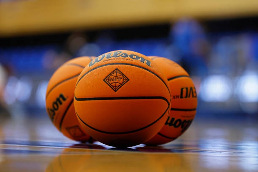 Wilson basketballs marked with the NIT logo sit on the floor before an NIT quarterfinal game between the UNLV Runnin' Rebels and Seton Hall Pirates...