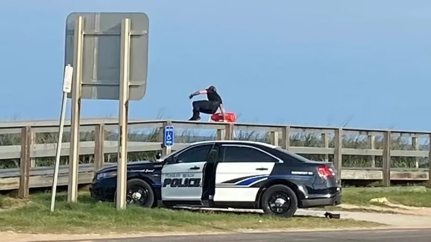 florida officer has baywatch moment saving 2 swimmers in daring ocean rescue