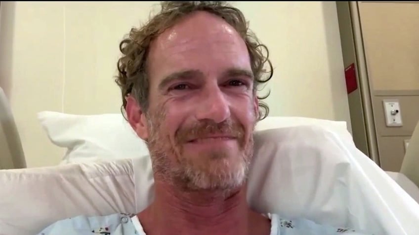 Matthew Bender in a hospital gown