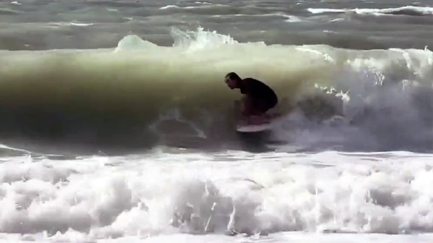 Matthew Bender surfing