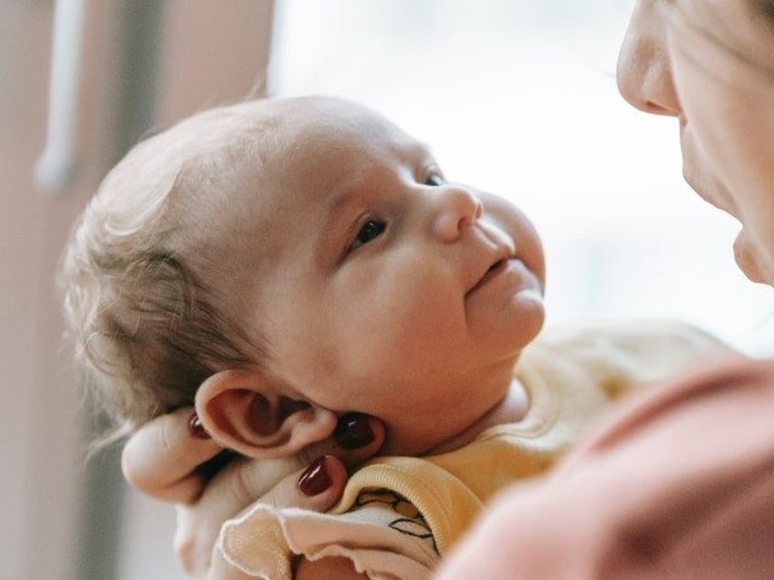 Woman with baby in arms