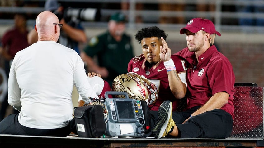 florida states jordan travis suffers gruesome leg injury reportedly transported in ambulance