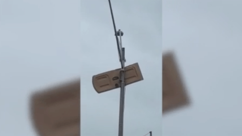 florida storms send porta potty door flying impales into a light pole national flag of florida