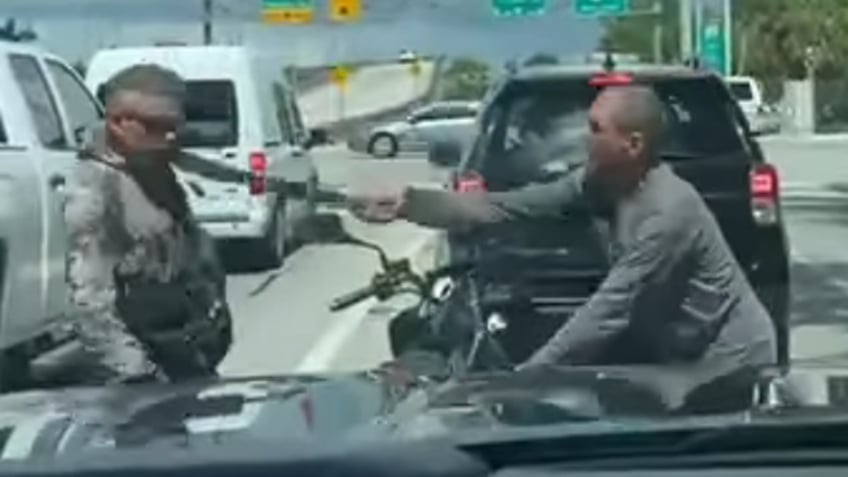 florida video shows driver swinging machete during road rage incident