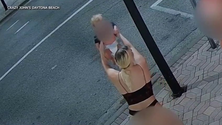 florida women outside coyote ugly bar seen tossing baby around like a toy moments before fight breaks out