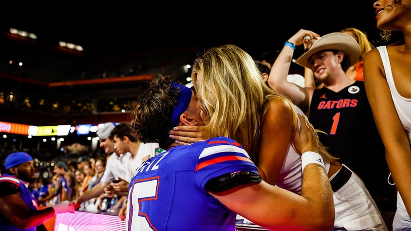 floridas graham mertz shares smooch with miss wisconsin girlfriend after massive win over tennessee