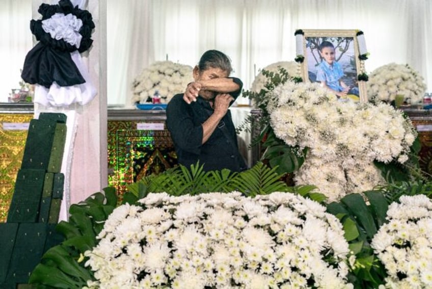 Five days of funeral prayers began in Thailand for 20 children and three teachers killed i