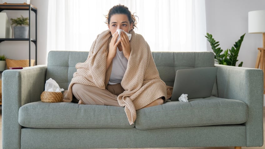 A sick person on a couch