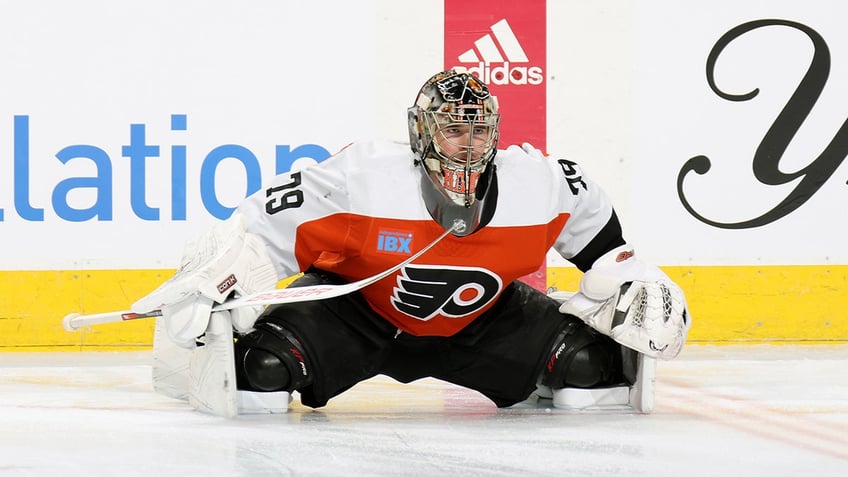 Carter Hart warms up