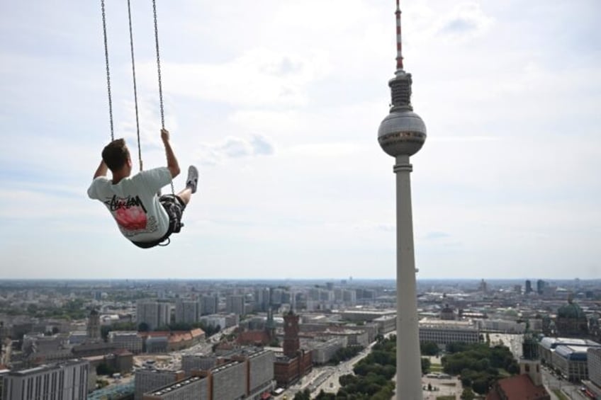 Don't look down: Pascal Vent swings 120 metres above the rooftops of Berlin from Europe’